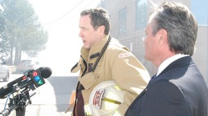 CYFS Deputy Fire Chief Paul Leslie, accompanied by Newmarket-Aurora MPP Frank Klees, update the media amid the smoke just after 3 p.m.