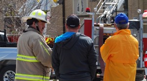 Mayor Dawe, right, watches the blaze with CYFS Chief Ian Laing, left, and Aurora CAO Neil Garbe.