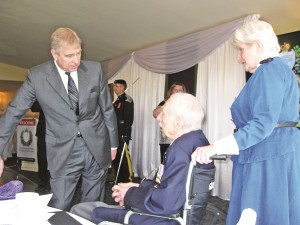 The Duke of York meets Aurora veterans John Wilkes and Dorothy Gummersall at Thursday's fundraising lunch.