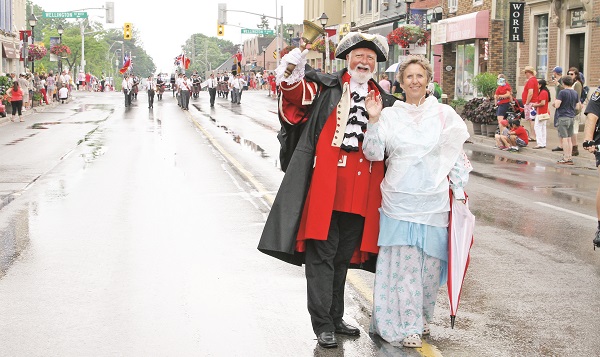 The Canada Day Parade was led by John Webster, Aurora's Official Town Crier, and his wife, Mary. 