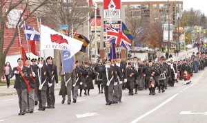The Royal Canadian Legion Colour Guard led veterans, troops, cadets and dignitaries down Yonge Street to the Cenotaph.